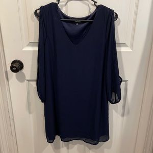 Navy blue long sleeve dress with an open arm